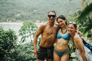 a man and a woman standing on a beach