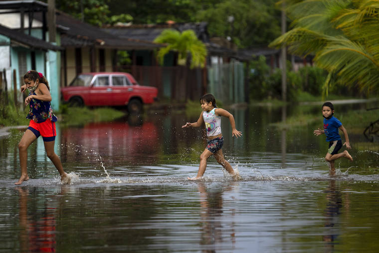 a group of people playing in the water